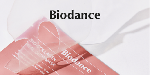 Biodance Bio-Collagen Real Deep Mask, pink-orange packaging with a translucent sheet mask partially covering it, white background.