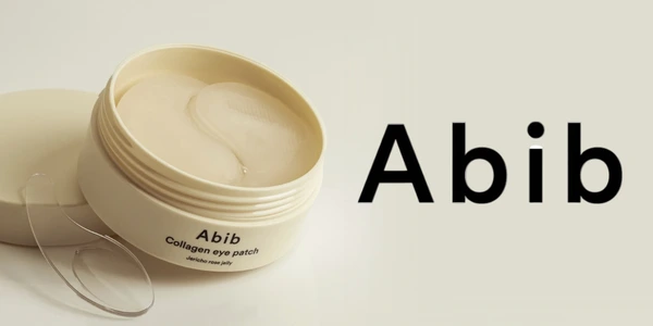 Abib Collagen Eye Patch Jericho rose jelly w otwartym, beżowym słoiczku z przezroczystymi płatkami pod oczy. Widoczne logo Abib.