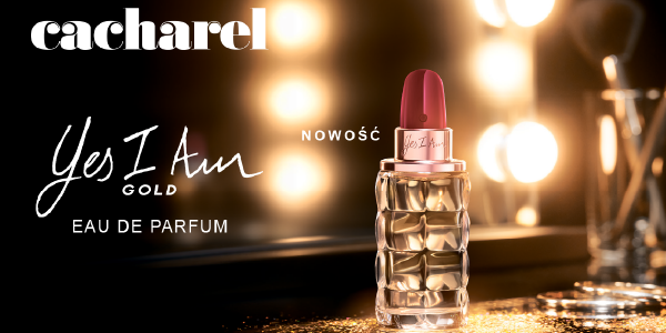 Cacharel Yes I Am Gold EDP 'NOWOŚĆ', złota butelka szminki na blacie ze światłami, czerwona nakrętka.