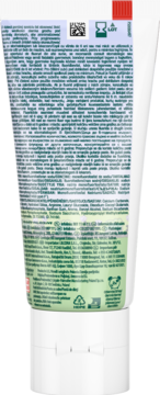 Tył białej tubki pasty Colgate Big Kids Smiles dla dzieci, z zielonym panelem, drobnym tekstem i symbolami recyklingu.