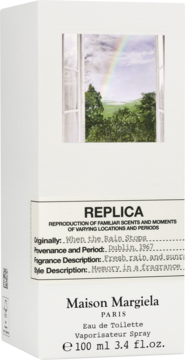 Białe pudełko perfum Maison Margiela Replica When the Rain Stops, z obrazkiem tęczy przez okno.