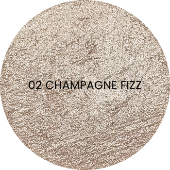 Okrągły rozświetlacz Dreamlighter 02 Champagne Fizz, beżowo-złoty, błyszczący, widok z góry.