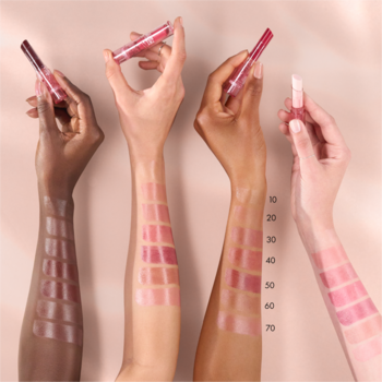 Catrice Care In Colours 030 Bubbly Friday lip balm swatched glossily on four diverse skin tones.
