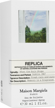 Maison Margiela REPLICA When the Rain Stops EDT w białym pudełku z obrazem tęczy za oknem, widok z przodu.