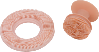 Dwie różowe myjki silikonowe Donegal do twarzy i ciała: długa spiralna i mniejsza ergonomiczna.