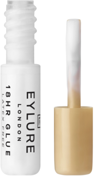 Biały klej do rzęs Eylure 18HR GLUE (Latex Free) z wysuniętym aplikatorem, widok z przodu.