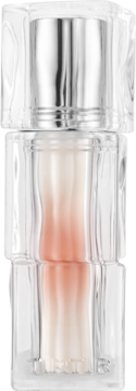 Mini tint do ust TIRTIR Waterism Glow w odcieniu Snowy Peach. Przejrzyste opakowanie z brzoskwiniowym gradientem i srebrną nakrętką. Widok z przodu.