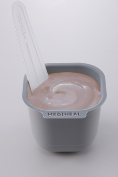 Ujędrniająca maska kolagenowa Mediheal Derma Modeling Pack w szarym pojemniku, biała szpatułka zanurzona w masie.