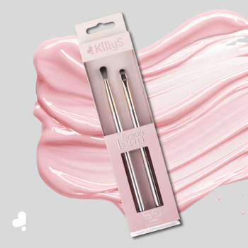 Dwa pędzle KillyS Beauty Icon do cieni z metalowymi rączkami w różowym opakowaniu, na szaro-różowym tle.