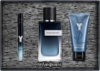 Zestaw YSL Y męski: butelka perfum, spray i żel pod prysznic. Ciemnoniebieski, drzewny zapach, teksturowane tło.