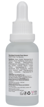 Tył butelki serum przeciwstarzeniowego Stop Aging Formula, biała etykieta ze składnikami i danymi firmy.
