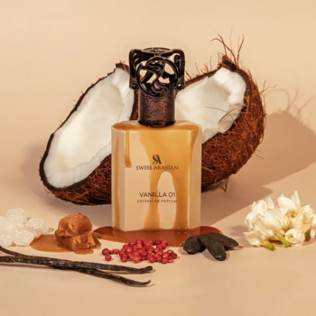SWISS ARABIAN Vanilla Oud, perfumy w bursztynowym flakonie z karmelowymi kroplami, obok kokosa i wanilii.