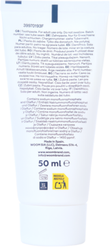 Tył tubki pasty do zębów WOOM ENAMEL REPAIR PRO na białym tle, z wielojęzycznym opisem, listą składników i objętością 50 ml.