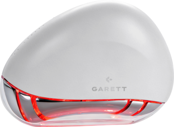 Biały masażer do twarzy Garett Beauty Glow Stone owalny, z czerwoną poświatą LED u dołu, widok z przodu.