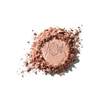 CATRICE More Than Glow prasowany rozświetlacz. Rozsypany puder w odcieniu różowego złota z kwiatowym wzorem.