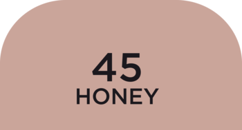Półokrągła próbka koloru podkładu WONDER MATCH w odcieniu 45 HONEY. Jasnobrązowy beż z czarnymi napisami.