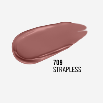 Close-up swatch matowej pomadki Rimmel Lasting Mega Matte w odcieniu 709 Strapless (brudny róż), na szarym tle.