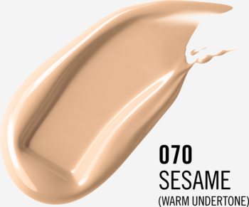 Swatch podkładu Rimmel Lasting Finish 35H w odcieniu 070 Sesame, ciepły beż, na szarym tle.