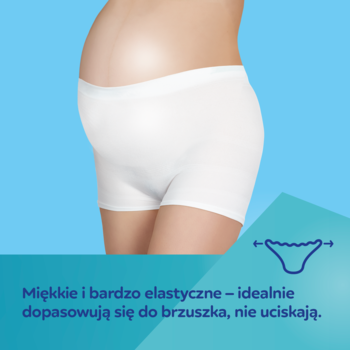 Kobieta w zaawansowanej ciąży w białych, bezszwowych majtkach Canpol babies Ultra Soft, widok z boku.