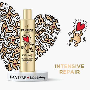Złoty szampon Pantene Pro-V Intensive Repair Keith Haring, z artystycznymi postaciami, widok z przodu.