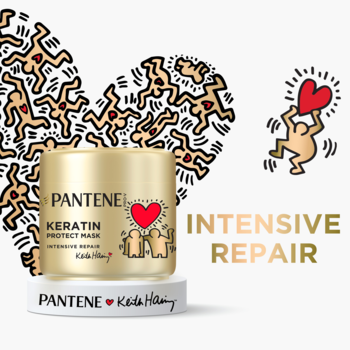 Złota maska Pantene Keratin Protect, edycja Keith Haring, z sercem i postaciami, na białym tle, widok z przodu.