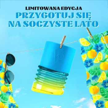 Letnia edycja Bruno Banani EDT. Butelka niebiesko-żółta wisi na sznurku obok spodenek, na tle błękitnego nieba.