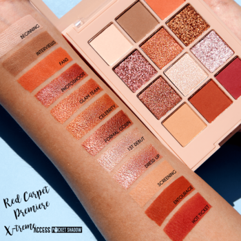 J.Cat Beauty X-treme Access Red Carpet Premiere paleta 12 ciepłych cieni. Na ramieniu swatche matowych i błyszczących odcieni.