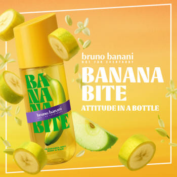 Bruno Banani Banana Bite mgiełka, żółta butelka z zielonym bananem, w otoczeniu plasterków banana i kwiatów.