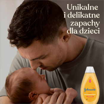 Ojciec całuje niemowlę, obok Johnson's Baby Szampon. Łagodna formuła, tekst: "Unikalne i delikatne zapachy".