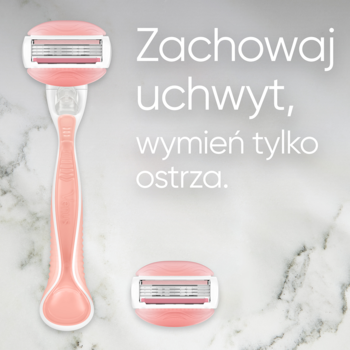 Różowa maszynka Gillette Venus Comfortglide obok wymiennego ostrza, na marmurze. Napis: „Wymień tylko ostrza”.
