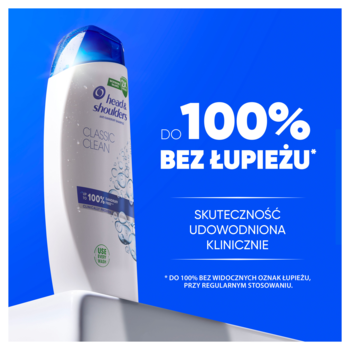 Biała butelka szamponu Head & Shoulders Classic Clean z niebieskim korkiem, widoczny napis 'do 100% BEZ ŁUPIEŻU' na niebieskim tle.