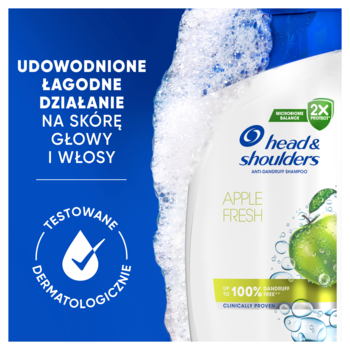 Biała butelka szamponu H&S Apple Fresh z pianą, z zielonym jabłkiem, tekstem o łagodnym działaniu i testach dermatologicznych.