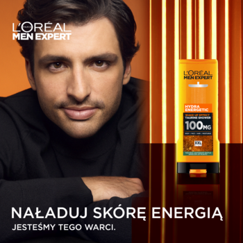 L'Oréal Men Expert Hydra Energetic żel pod prysznic w pomarańczowej butelce obok modela. Napis: Naładuj skórę energią.