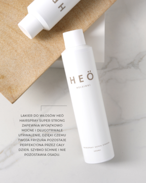 Lakier do włosów Heö Helsinki Hairspray Super Strong w białej butelce ze złotym logo, widok z boku.