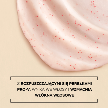 Zbliżenie maski Pantene Pro-V Grow Abundant; kremowa konsystencja z czerwonymi perełkami Pro-V, tekst o Pro-V.