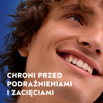 Uśmiechnięty mężczyzna, reklama pianki do golenia NIVEA MEN, napis "CHRONI PRZED PODRAŻNIENIAMI I ZACIĘCIAMI".