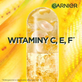Garnier Banana Hair Food: Duża kapsułka z witaminami C, E, F i żółtym płynem na bananowym tle.
