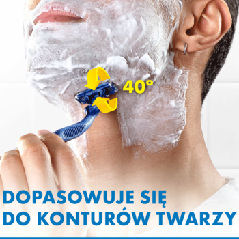 Maszynka do golenia z niebieską rączką i żółtą główką 40°, goli twarz mężczyzny pokrytą pianą.
