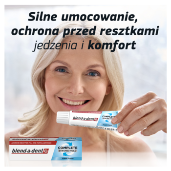 Blend-a-dent Complete klej do protez, biała tubka i pudełko. Uśmiechnięta kobieta prezentuje silne umocowanie.
