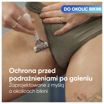 Gillette Venus Satin Care maszynka do golenia dla kobiet. Biało-niebieska maszynka używana w okolicach bikini, chroni przed podrażnieniami.