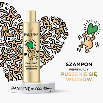 Złoty szampon Pantene Pro-V Keith Haring Smooth & Silky, redukujący puszenie, na tle serca z postaciami Haringa.