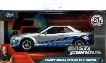 Srebrny model Jada Toys Fast & Furious Brian's Nissan Skyline GT-R 1:32 w pudełku, z niebieskimi pasami.