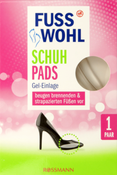 Opakowanie Fuss Wohl Schuh Pads Gel-Einlage na pieczenie stóp, widok z przodu. Różowo-zielone tło, but.