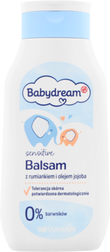 Babydream sensitive Balsam z rumiankiem i olejem jojoba, biała butelka z niebieską nakrętką, widok z przodu.
