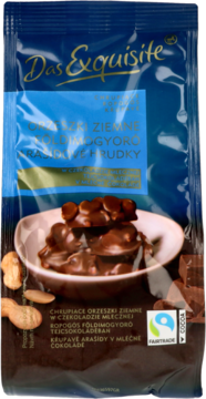 Front opakowania Das Exquisite: chrupiące orzeszki ziemne w mlecznej czekoladzie, widoczne bryłki produktu.