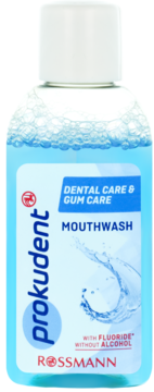 Płyn do płukania ust Prokudent Dental Care & Gum Care, niebieska butelka z białą nakrętką, widok z przodu, bez alkoholu.
