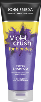 John Frieda Violet Crush Purple Shampoo dla blondynek, fioletowo-żółta tuba z efektem fioletowego pyłu.