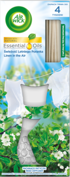 Opakowanie Air Wick Reed Diffuser "Linen in the Air". Złożony dyfuzor, patyczki, pranie na tle zieleni i słońca.