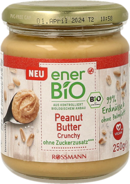 Słoik enerBIO Crunchy Peanut Butter (99% orzeszków) bez cukru i oleju palmowego. Na etykiecie łyżka z masłem.