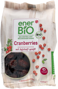 EnerBiO Bio Żurawina suszona, słodzona sokiem jabłkowym, w beżowej torebce z ilustracją owoców, widok z przodu.